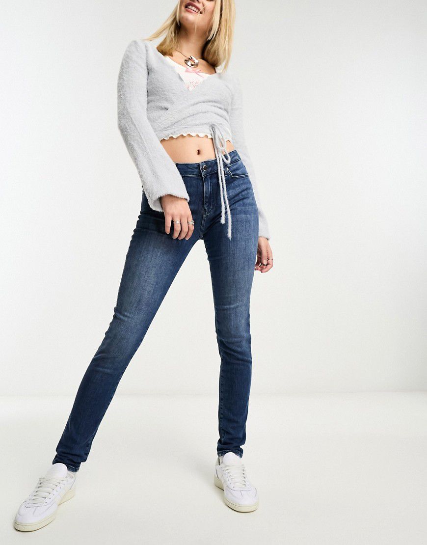 Jeans skinny lavaggio medio con stampa del logo a forma di cuore - Love Moschino - Modalova