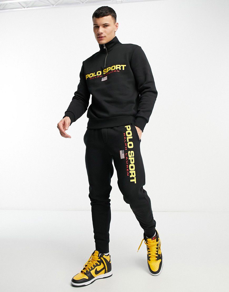 Sport Capsule - Joggers neri con fondo elasticizzato e logo sulla gamba in coordinato - Polo Ralph Lauren - Modalova