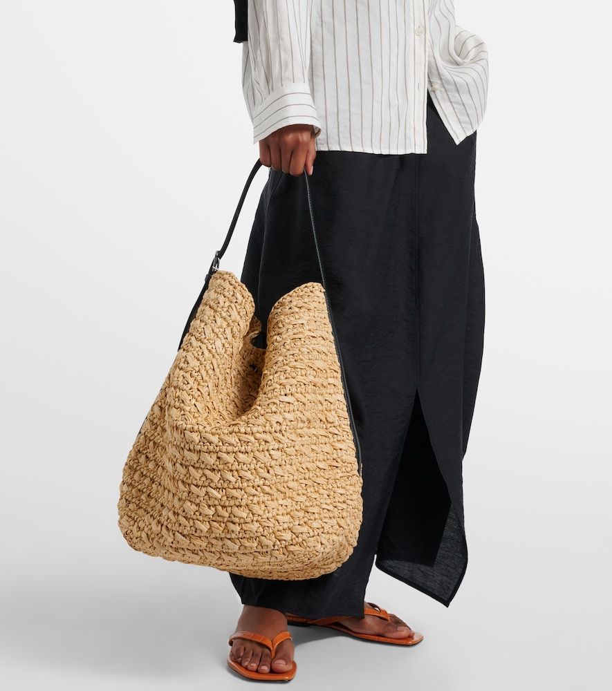 Leather-trimmed raffia and paper bucket bag - Toteme - Modalova