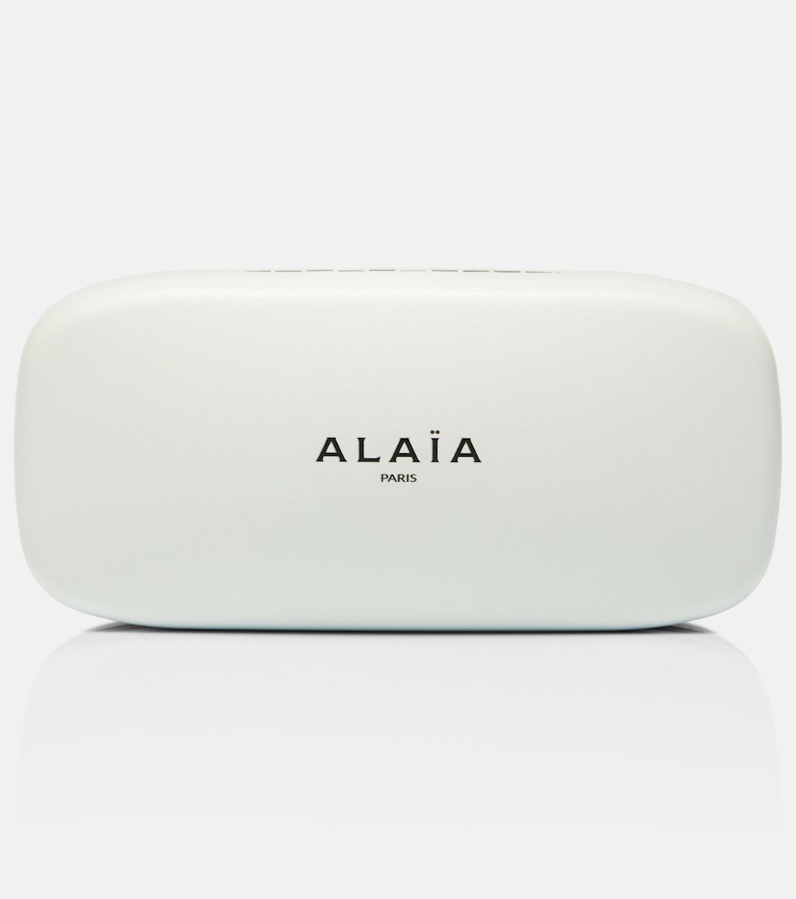 Alaïa Runde Sonnenbrille Lettering Logo - Alaia - Modalova
