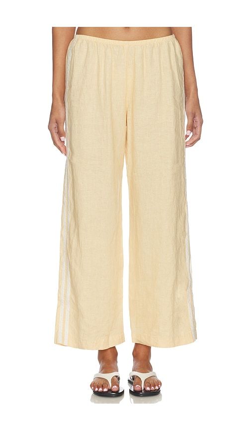 The Linen Crop Racer Stripe Pant in Yellow. - size M (also in S, XS) - DONNI. - Modalova