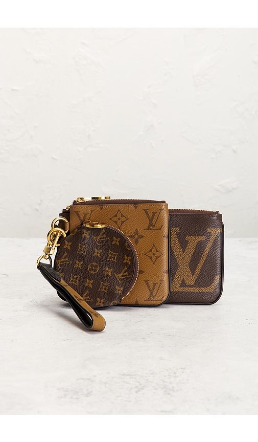 Louis Vuitton Reverse Monogram Giant Trio Pouch in - FWRD Renew - Modalova