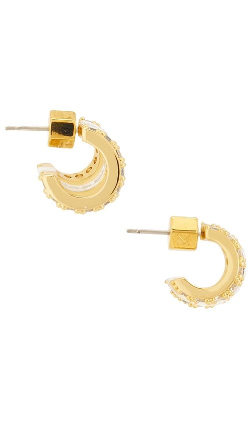 Sabrina Huggies Earrings in Metallic - MIRANDA FRYE - Modalova