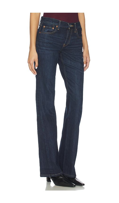 Twisted Mid Rise Bootcut Jeans in Blue. - size 26 (also in 27, 29, 30, 31, 32) - RE/DONE - Modalova