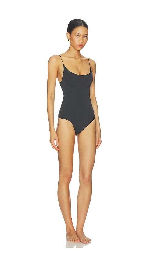 Sheer Seamless Thong Bodysuit in Black. - size L (also in M, S, XL, XXL) - SKIMS - Modalova