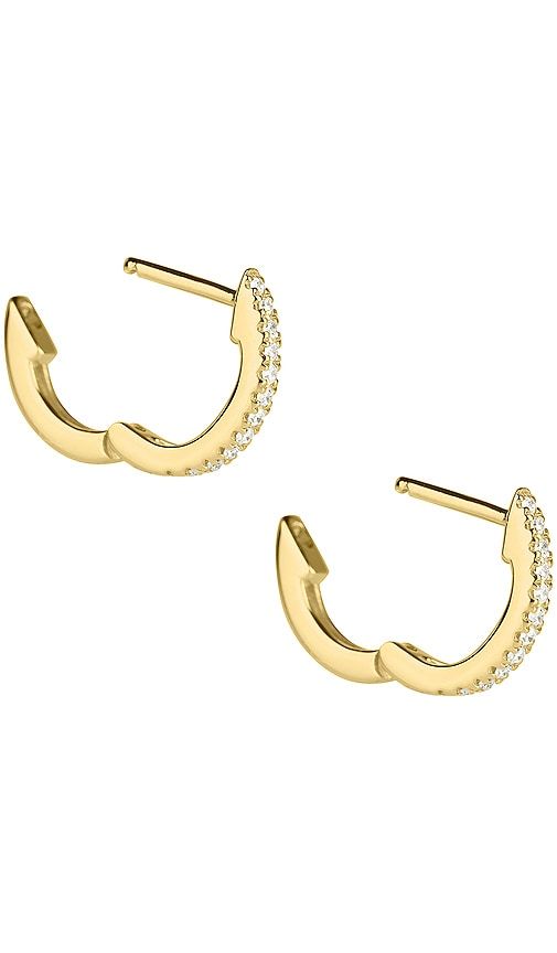 White Pave Huggie Earrings in Metallic - STONE AND STRAND - Modalova